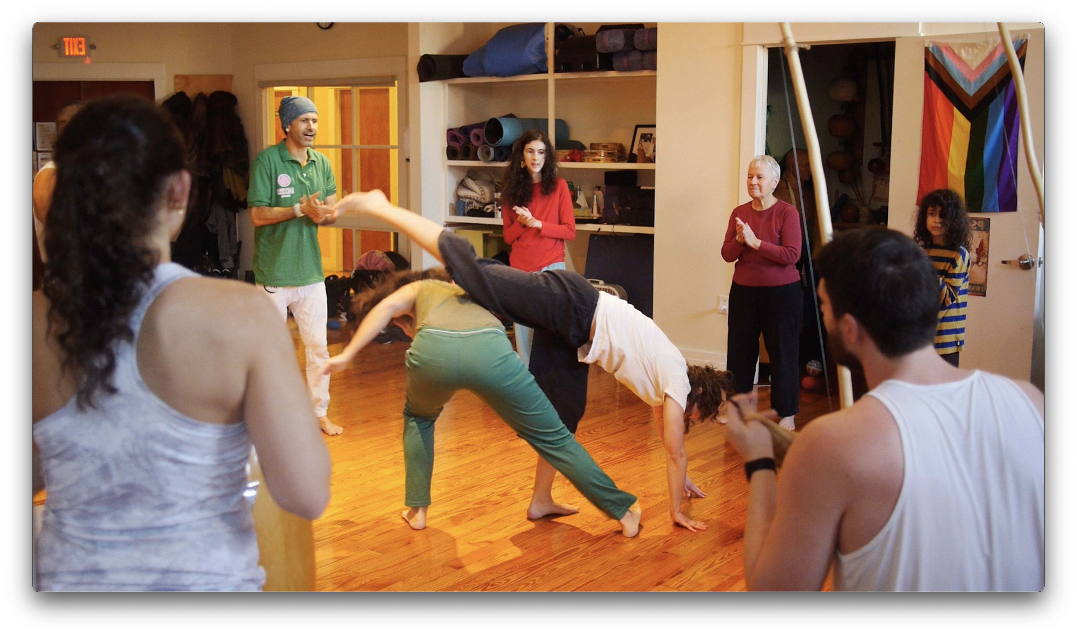 Students practicing Capoeira movements and techniques